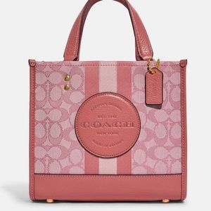 Selling brand new Coach Dempsey Pink Bag.